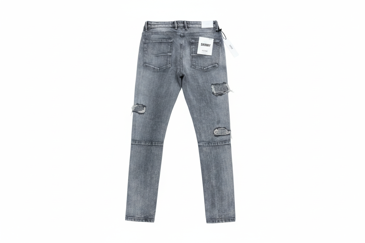 Gray distressed skinny jeans on white background